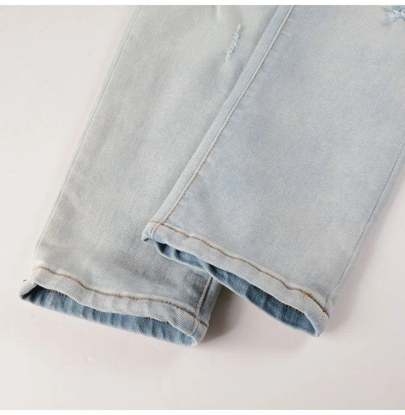 Men Pale Light Blue Biker Jeans Cracked Pleated Patch Patchwork Stretch Denim Pants Streetwear Holes Ripped Skinny Trousers